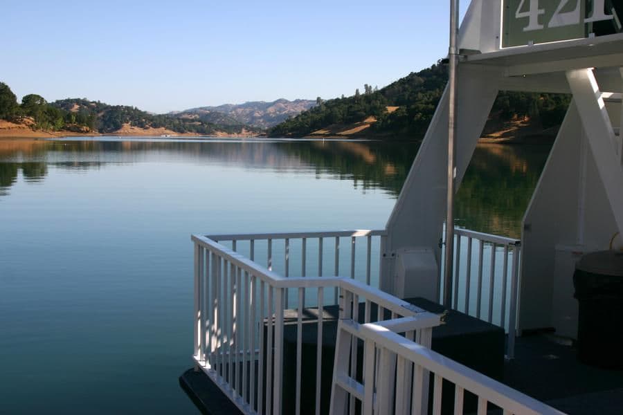 Take in a peaceful view of the lake from the deck of the houseboat