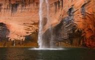 Leftover rain offers a sense of waterfalls cascading off canyons