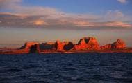 Tall canyons surrounded by vast blue waters just into open skies