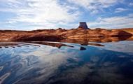 Glassy water merges with the stunning scenery