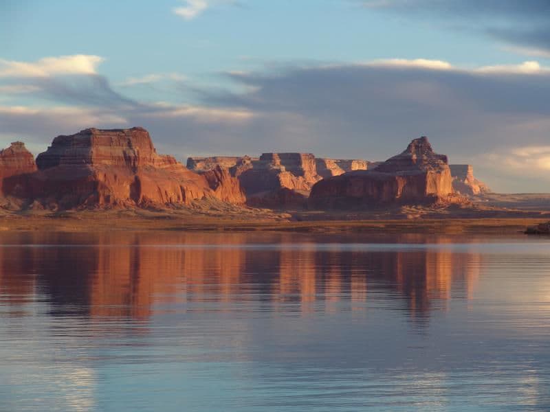 Red canyons fill the blue open sky providing a most astonishing view Photos