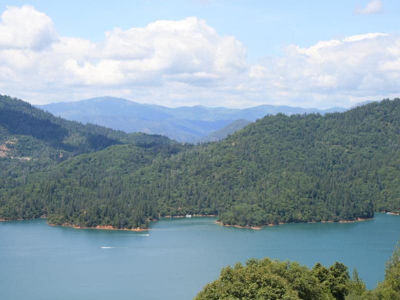 Enjoy the scenery of lush mountain ranges towering into blue skies Photos