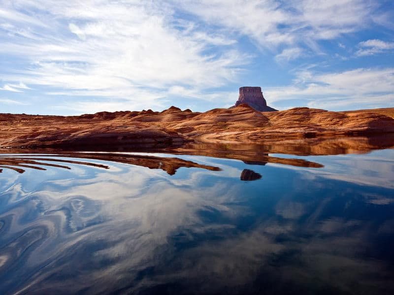 Glassy water merges with the stunning scenery Photos