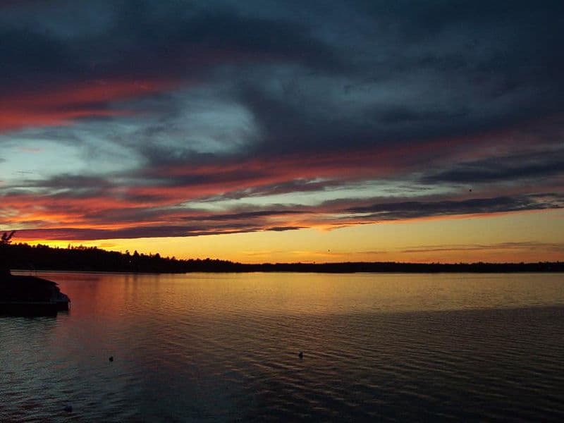 The kind of vibrant and stunning sunset you can expect on your trip Photos